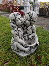 Kissing Boy and Girl with Bucket