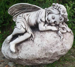 Sleeping Cherub On Rock